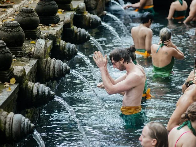 People bathing in holy spring water at Tirta Empul temple